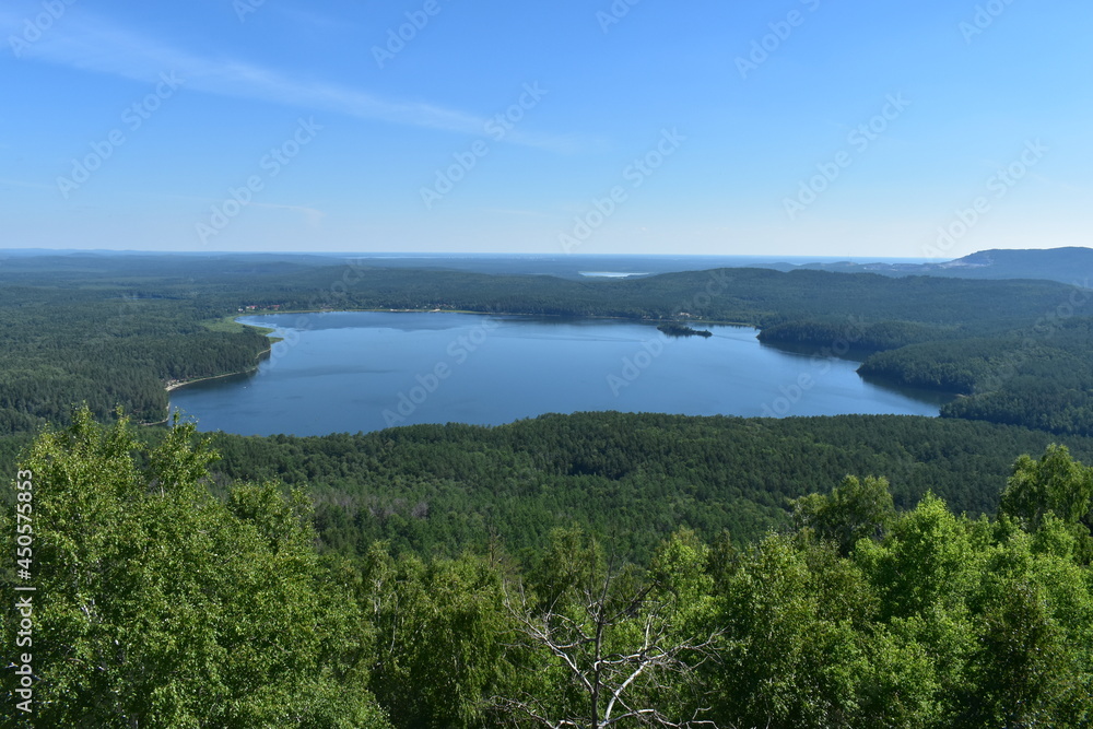 Obraz premium Lake in the middle of the forest