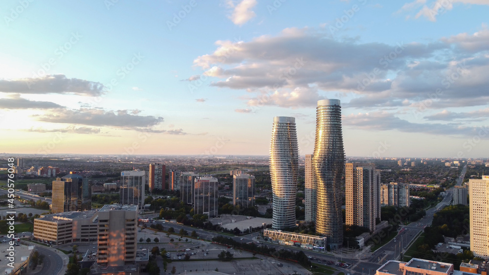 Obraz premium Aerial view of downtown Mississauga, Ontario, Canada landmark Absolute buildings condominiums. Looking east down Burnhamthorpe Road towards Hurontario Street. Shot on a beautiful summer afternoon.