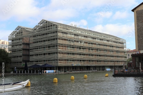 Les anciens magasins generaux, désormais hotels et restaurants, le long du canal de l'ourcq, vue de l'exterieur, ville de Paris, France photo