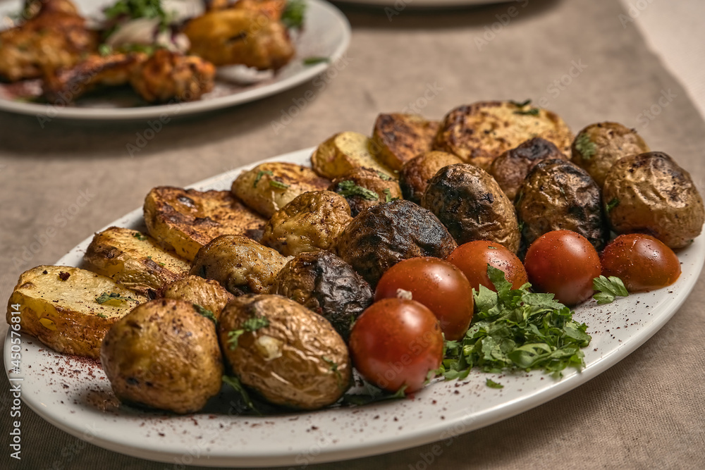 Baked potatoes and vegetables with herbs Baked potatoes and vegetables with herbs