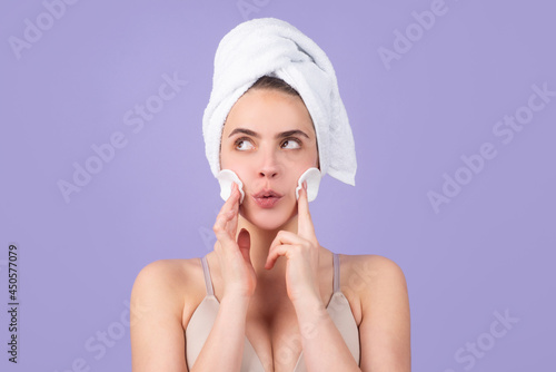 Beautiful girl with a towel on head, facial treatment, cosmetology, beauty and spa.