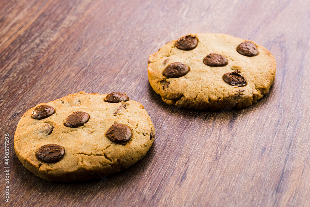 Chocolate cookies on wooden table. Close-up. Selective focus Chocolate cookies on wooden table. Close-up. Selective focus