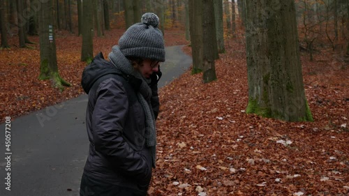 Wallpaper Mural Woman talking on the mobile phone in an autumn colored forest Torontodigital.ca