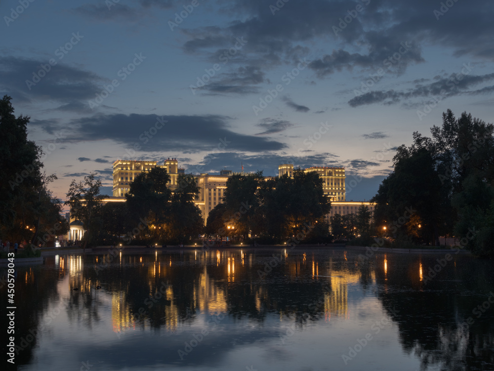 The Military Academy building reflected in the water in the evening