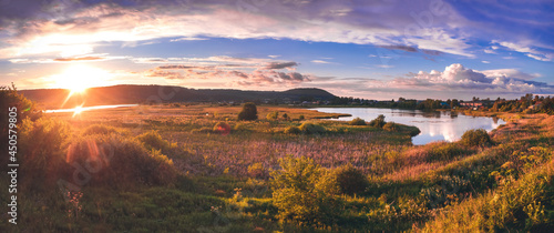 sunset over the lake and mountains