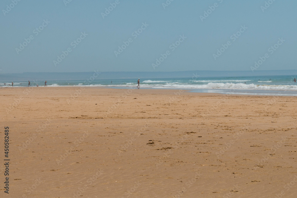 Caparica, Portugal: 09/05/2020: A mesmerizing view of a sandy beach with a lot of people in relax in Caparica, Portugal Caparica, Portugal: 09/05/2020: A mesmerizing view of a sandy beach with a lot of people in relax in Caparica, Portugal