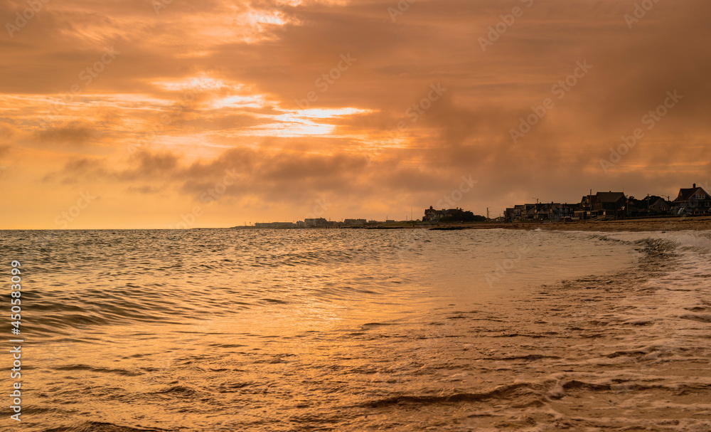 Gold-colored beach and sky on Cape Cod at a Summer's Dawn.
