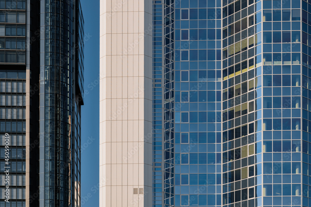 Exterior architectural detail modern facade of High-rise office buildings. Abstract Urban metropolis background.