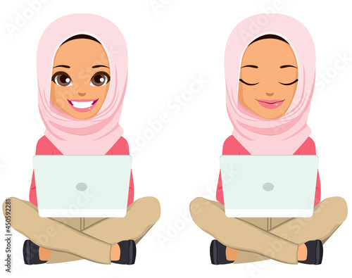 Young teenager Muslim girl sitting on floor using laptop showing two different face expression smiling and with closed eyes