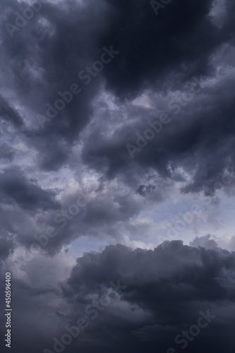 Epic Dramatic Storm sky with dark grey and black cumulus rainy clouds background texture, thunderstorm