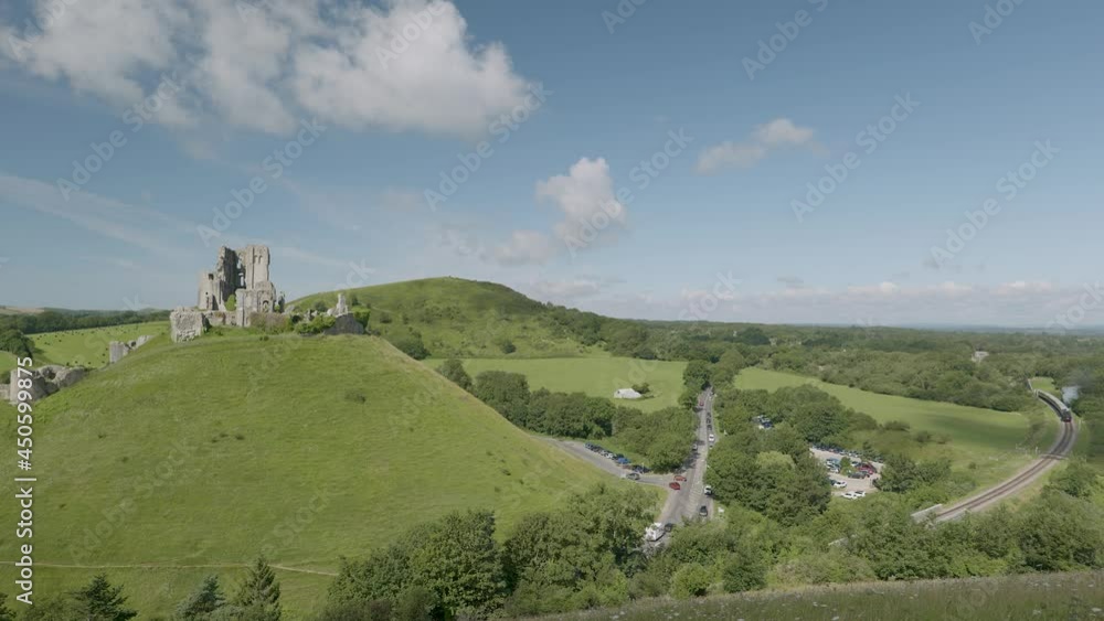 Steam train approaching Corfe Castle, Dorset, England Steam train approaching Corfe Castle, Dorset, England