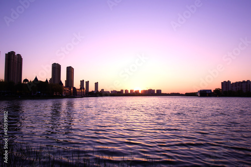 The city horizon against the setting sun