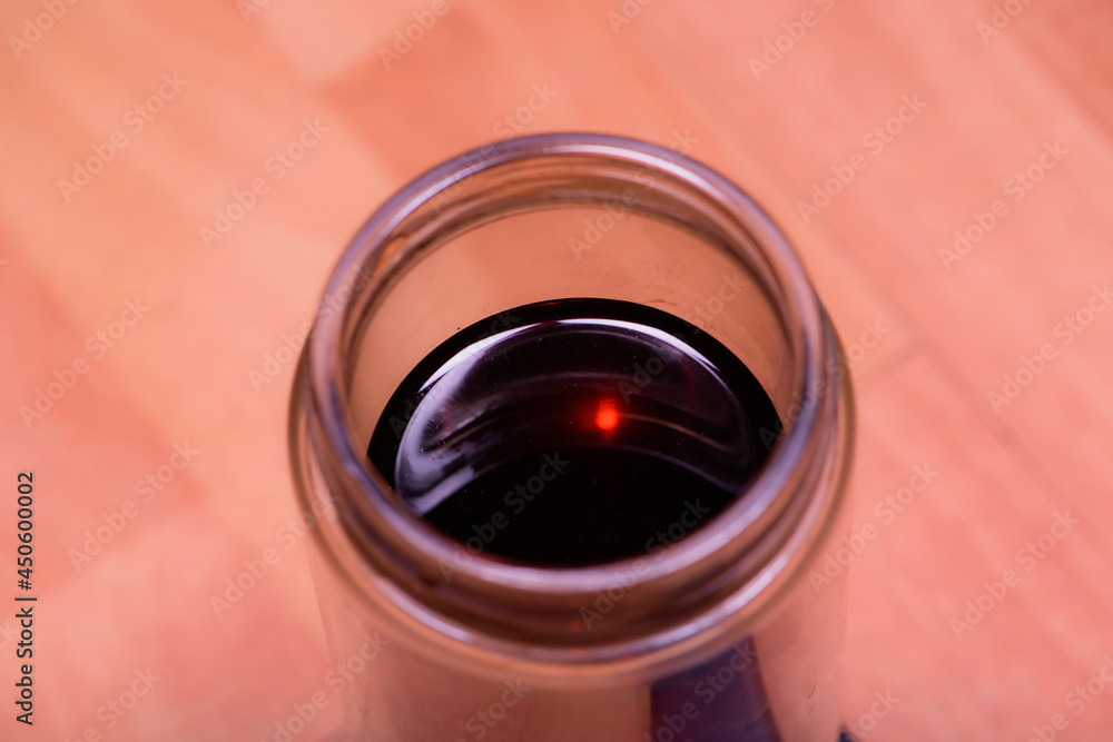 Take a close-up shot of a glass of tea from above Take a close-up shot of a glass of tea from above