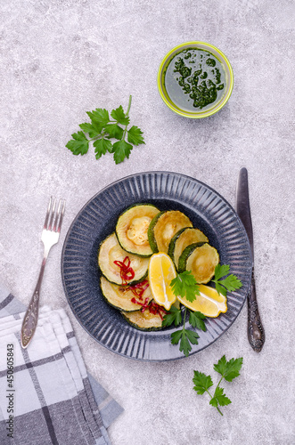Fried zucchini with green sauce