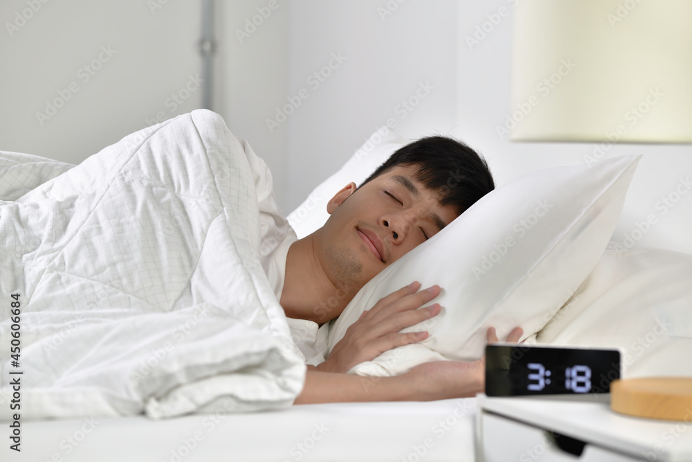 Handsome Young Asian man sleeping in bed Handsome Young Asian man sleeping in bed