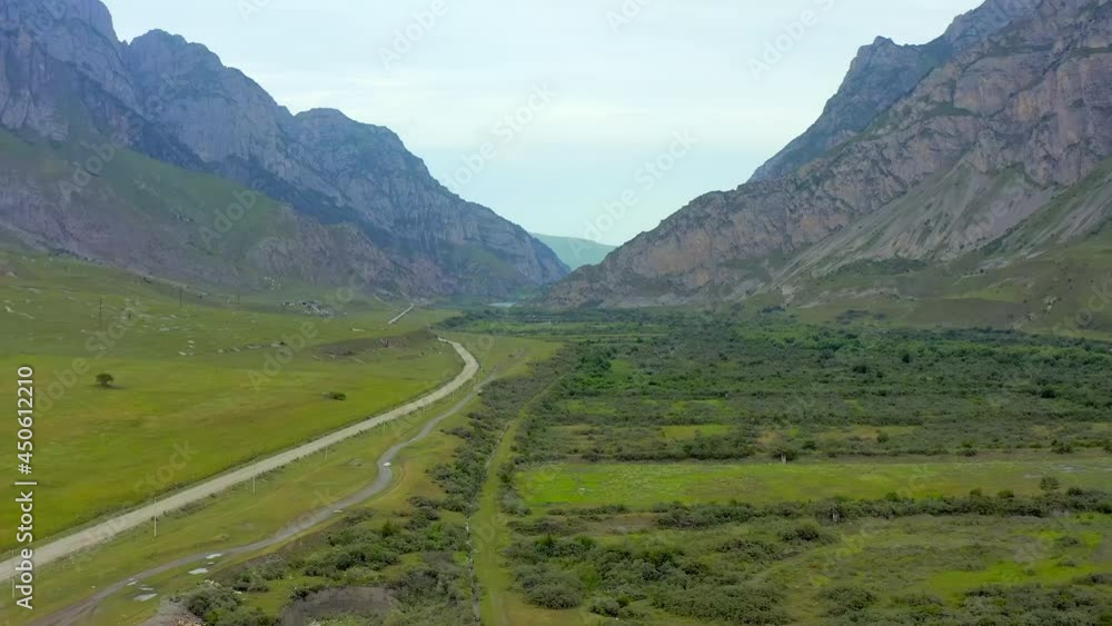 Aerial view. The road in the mountain valley Dargav gorge, beautiful view Aerial view. The road in the mountain valley Dargav gorge, beautiful view