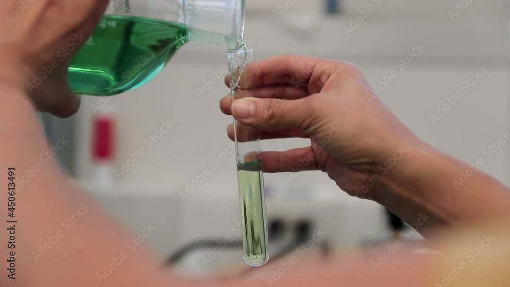 Scientist Filling Test Tube In A Lab Scientist Filling Test Tube In A Lab