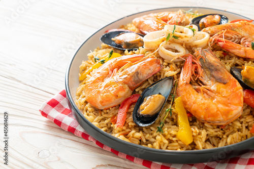 Seafood Paella with prawns, clams, mussels on saffron rice