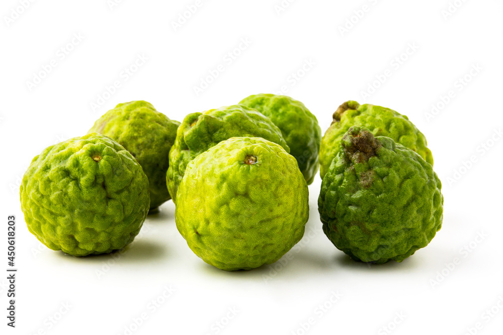 Group of bergamot isolated on white background, There are many names such as Kaffir lime, Leech lime and Mauritius papeda. it's green, rough, sour and aroma. Herbs for cooking and medicine. Group of bergamot isolated on white background, There are many names such as Kaffir lime, Leech lime and Mauritius papeda. it's green, rough, sour and aroma. Herbs for cooking and medicine.