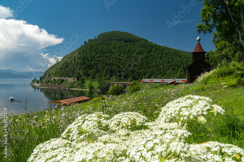 Passenger train stands at Staraya Angasolka station on the shore of Lake Baikal photo