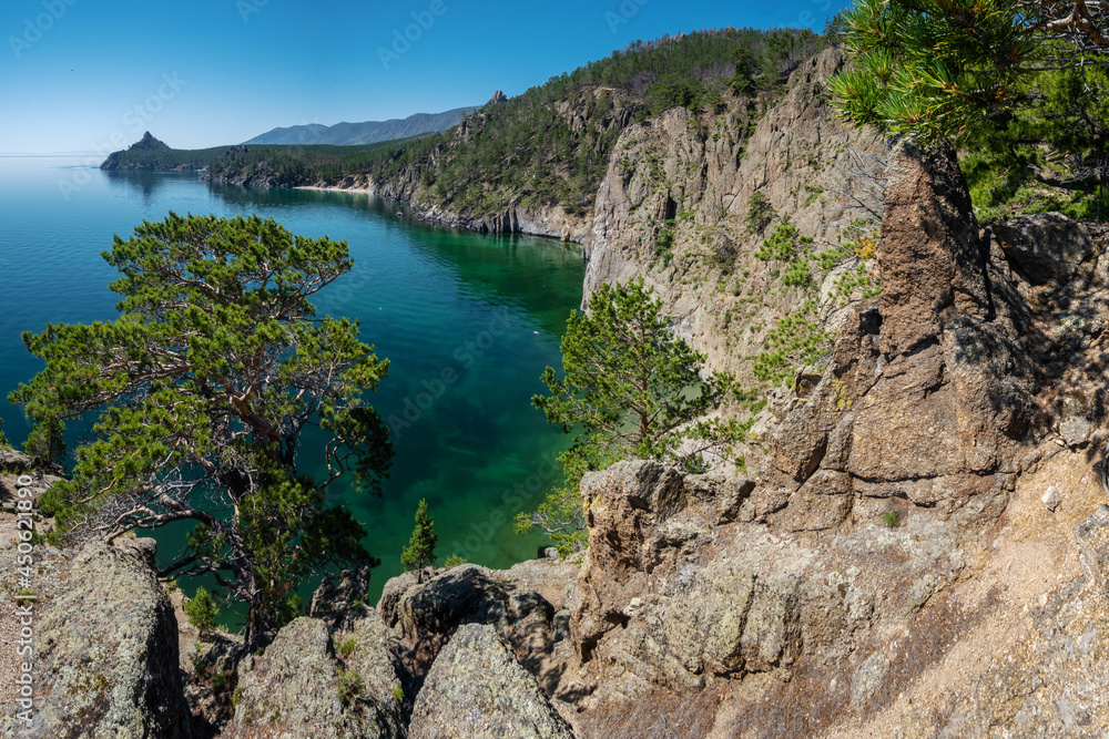 Fototapeta premium View of the rocky coast of Lake Baikal and Cape Bolshaya Kolokolnya