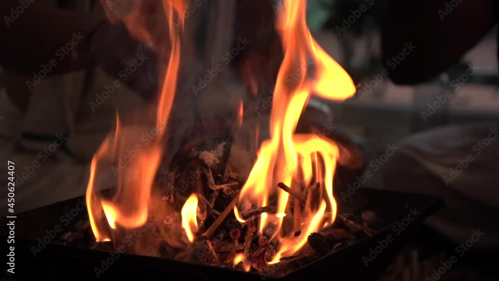 Making fire for rituals pooja and added some ghee dark theam. Making fire for rituals pooja and added some ghee dark theam.