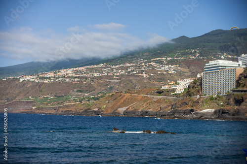 Quay of a popular tourist town Puero de la Cruz on the island of Tenerife, Canary Islands. Focus in the center. photo