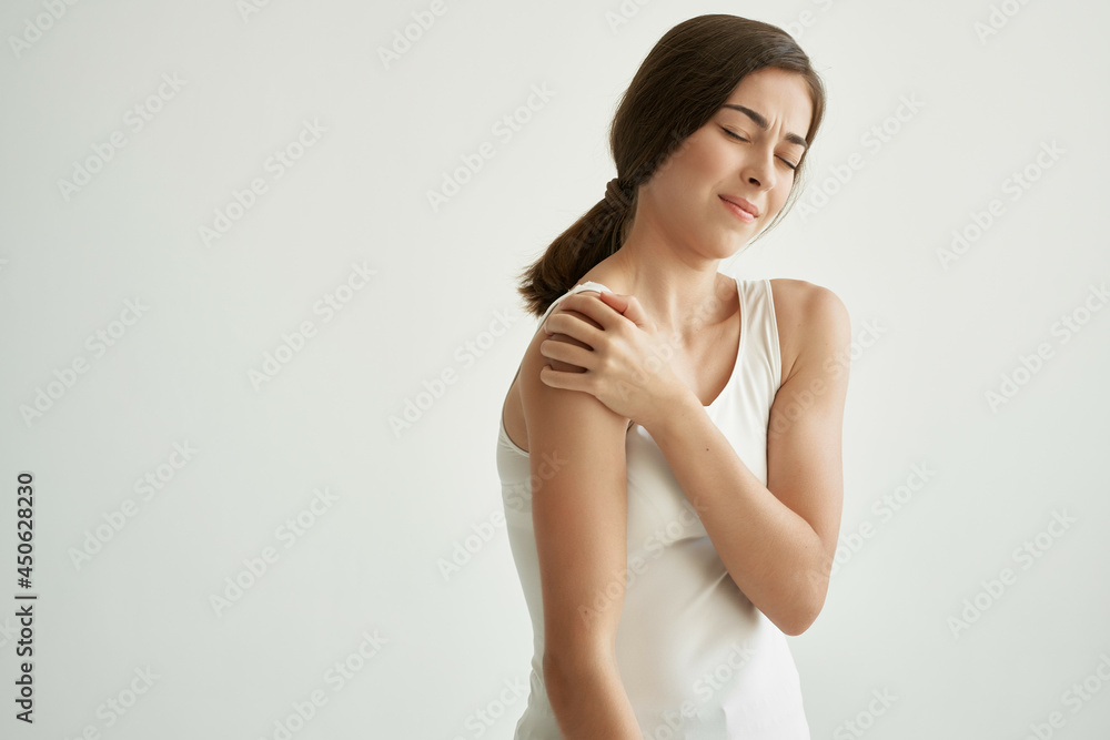 woman with joint pain health problems dissatisfaction light background woman with joint pain health problems dissatisfaction light background