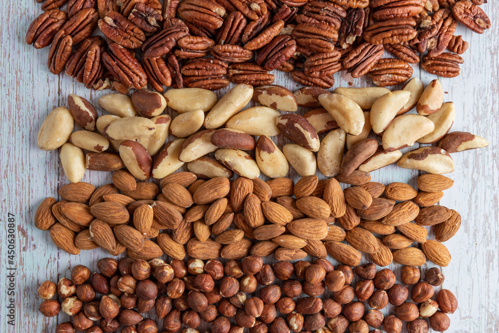 Mixed nuts, healthy fat and protein food, vegan, ketogenic diet, plant-based diet, natural sources of tryptophan for good sleep and relaxation, ketodiet concept Mixed nuts, healthy fat and protein food, vegan, ketogenic diet, plant-based diet, natural sources of tryptophan for good sleep and relaxation, ketodiet concept