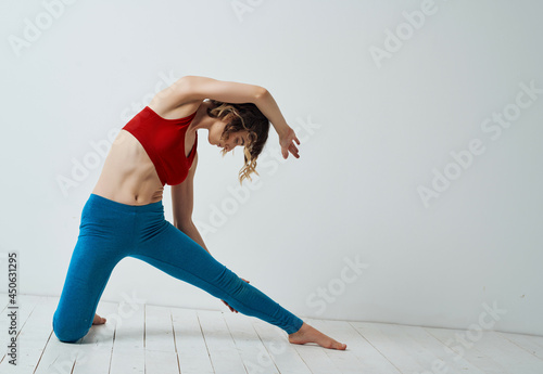 woman in sports uniform exercises fitness slim figure