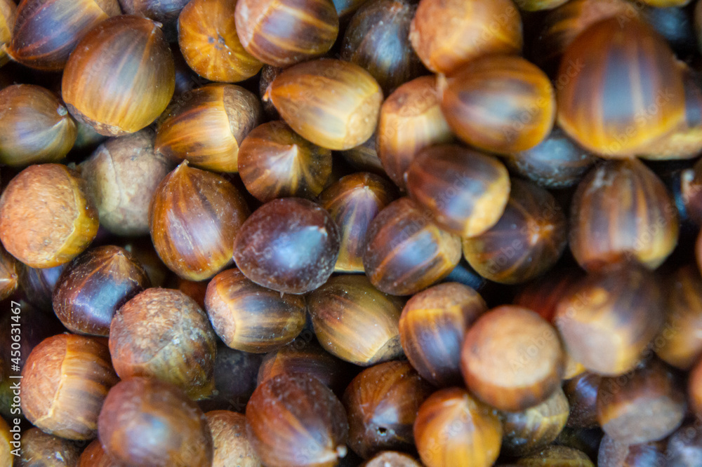 Top view heap of chestnuts. Pile of ripe chestnuts for food background Top view heap of chestnuts. Pile of ripe chestnuts for food background