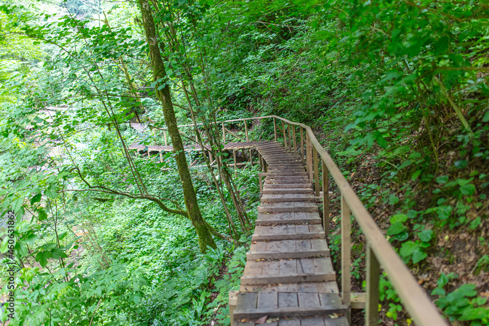 Wooden bridge on a mountain river.