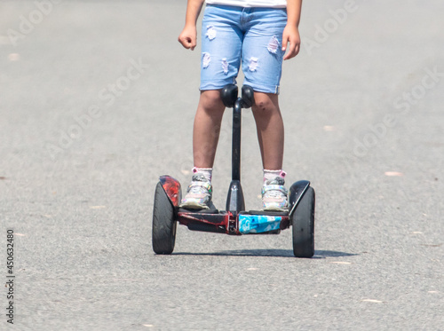 The girl is riding a gyro scooter