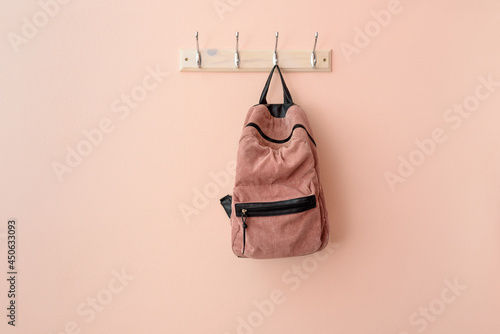 Obraz na płótnie Pink backpack on hook clothes hanger