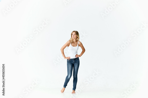 pretty blonde in jeans barefoot posing fashion isolated background
