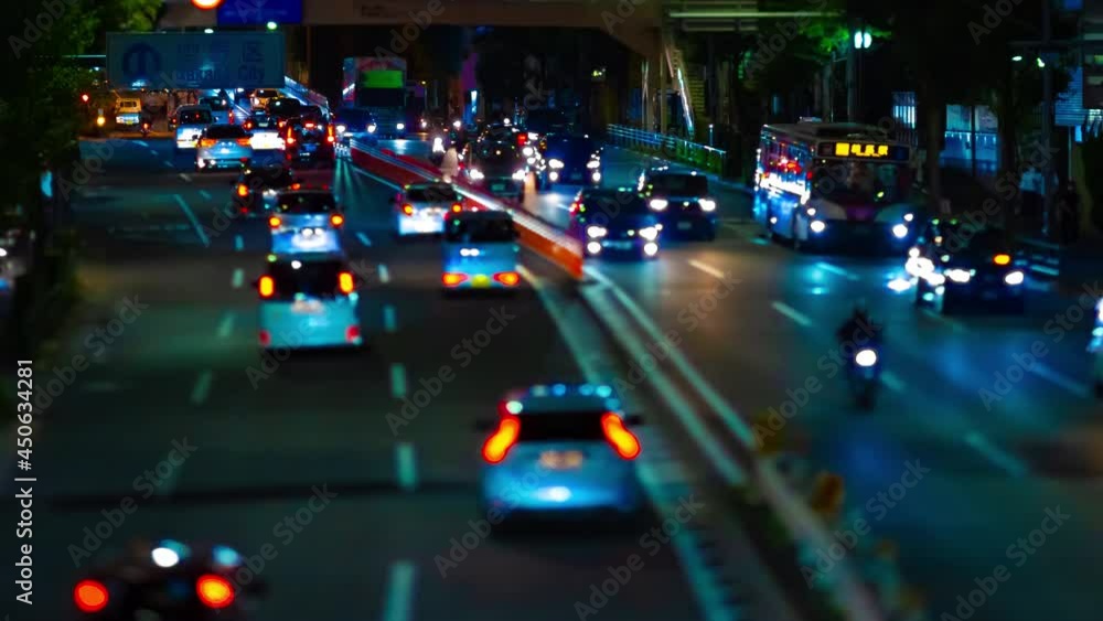 A night timelapse of miniature traffic jam at the downtown street tiltshift A night timelapse of miniature traffic jam at the downtown street tiltshift