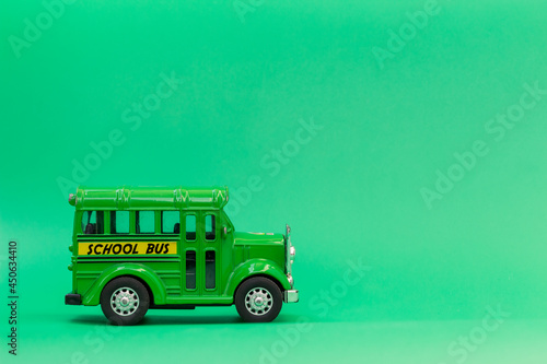 school bus green toy on green background