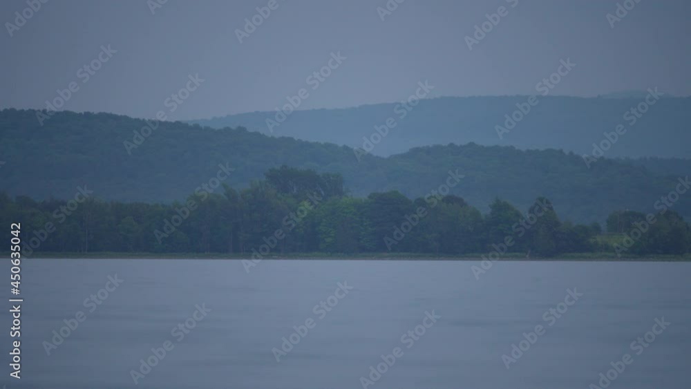 A speed boat drives through this calm landscape of Lake Champlain. This is one of the many breathtaking views seen from the shores of Grand Isle, Vermont. A speed boat drives through this calm landscape of Lake Champlain. This is one of the many breathtaking views seen from the shores of Grand Isle, Vermont.