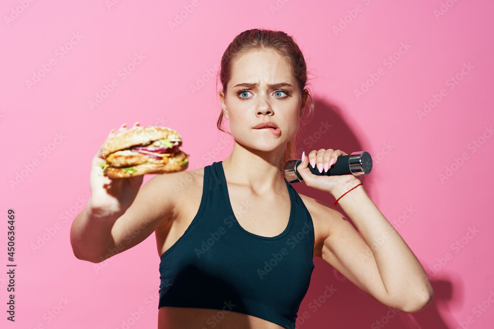 sportive woman workout hamburger fast food diet pink background sportive woman workout hamburger fast food diet pink background