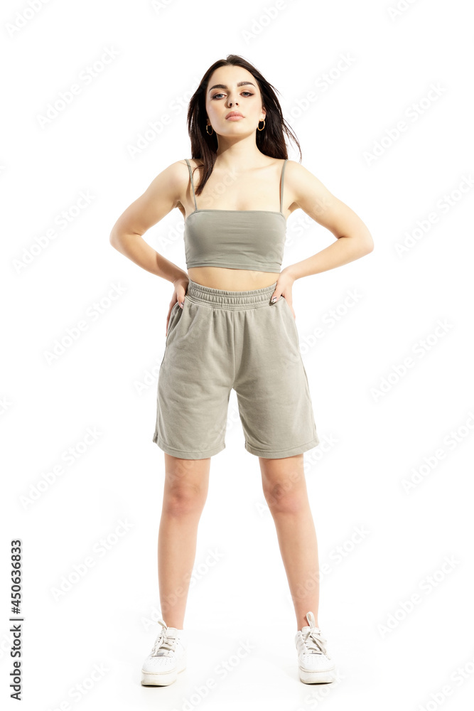 Confident cocky attitude young woman in summer clothes posing at camera. Full body portrait isolated on white background Confident cocky attitude young woman in summer clothes posing at camera. Full body portrait isolated on white background