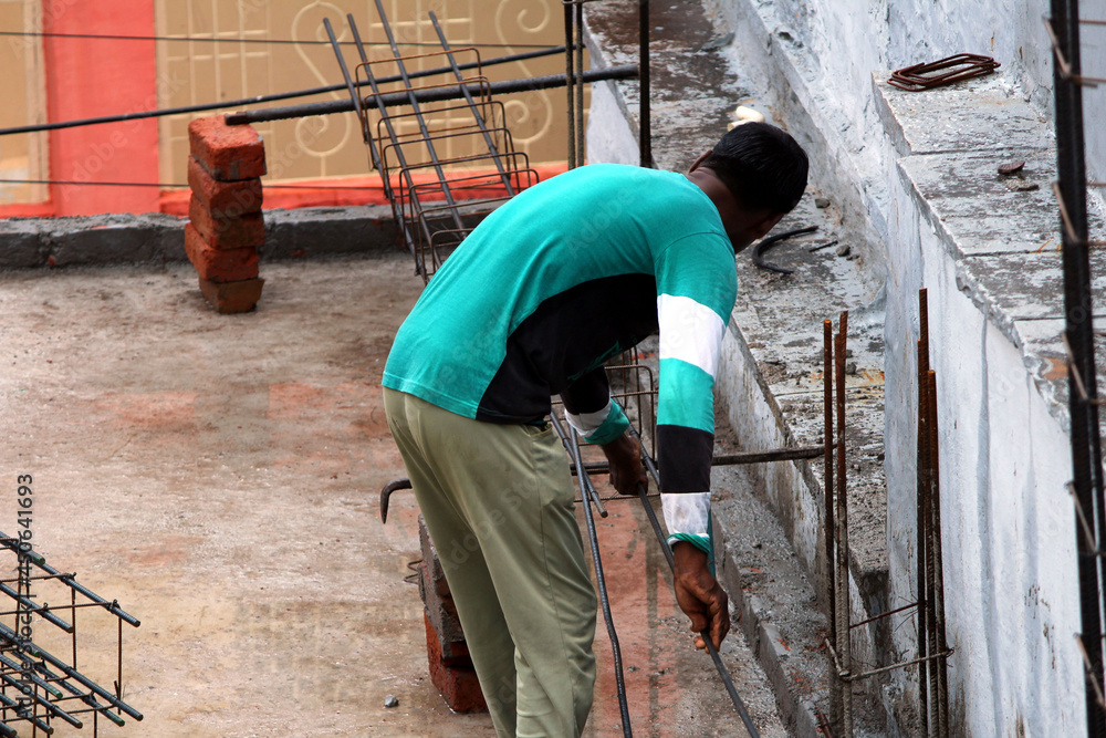 a worker doing work on construction site a worker doing work on construction site