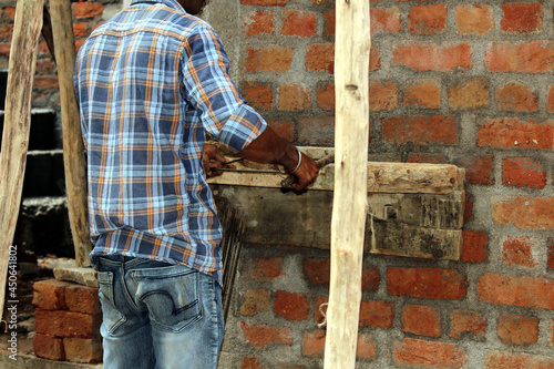Wallpaper Mural a worker doing work on construction site Torontodigital.ca