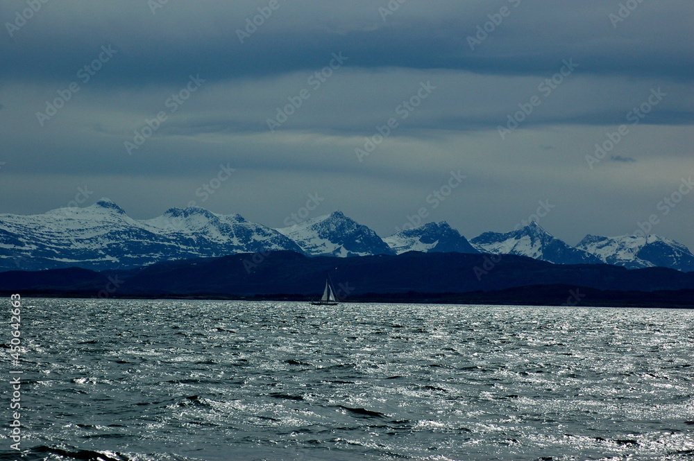 Snow-covered mountains along the coast Snow-covered mountains along the coast