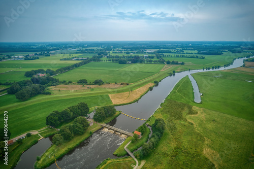 Obraz na płótnie Airial view of a weir in the river Vecht. Dutch river in a colorful landscape. Water authority Drents Delta Overijssel w salonie