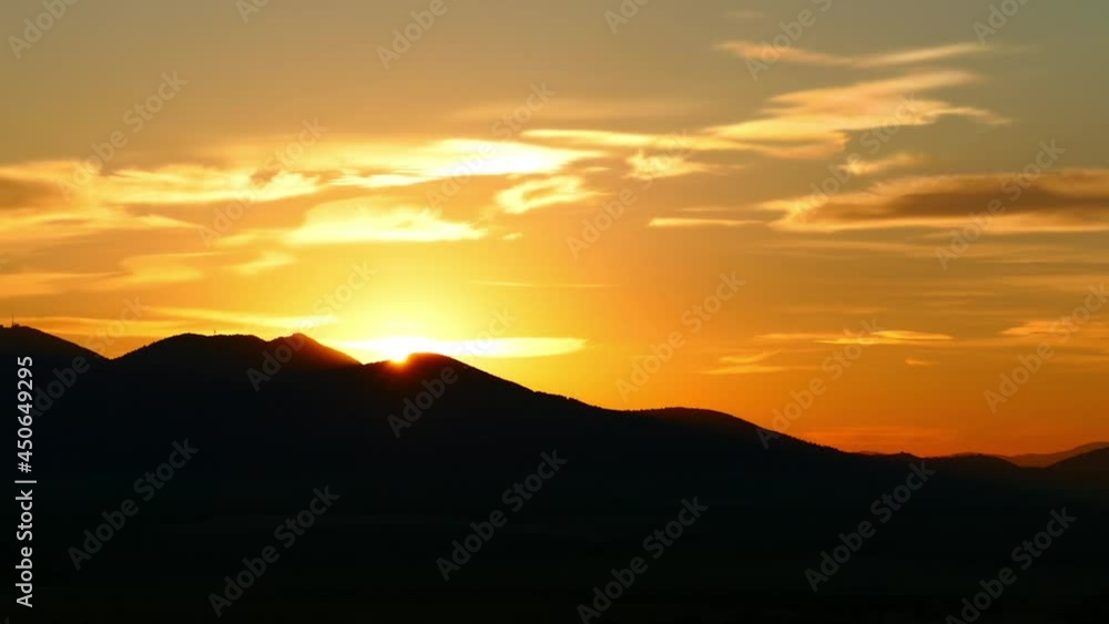 Golden sunset above mountain. Time lapse. Golden sunset above mountain. Time lapse.