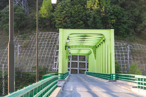 Green metallic bridge over the Sorachi River, Hokkaido, Japan