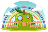 Green apple house with rainbow in the sky