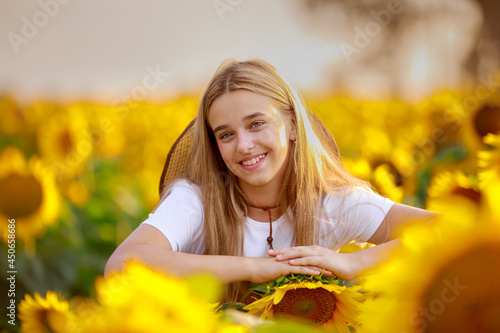 12 year old girl on a field of sunflowers