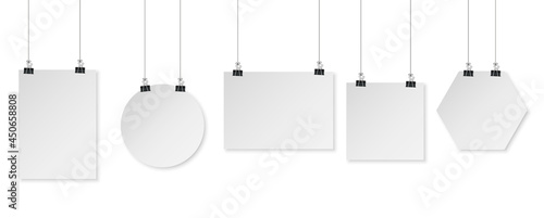 Set of binder clips on a piece of paper on a white background. Clerical clothespin vector illustration with shadow