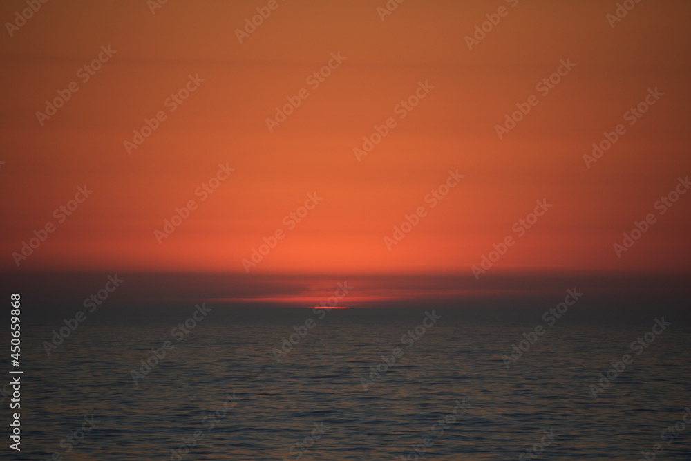 sunset over the sea sunset over the sea